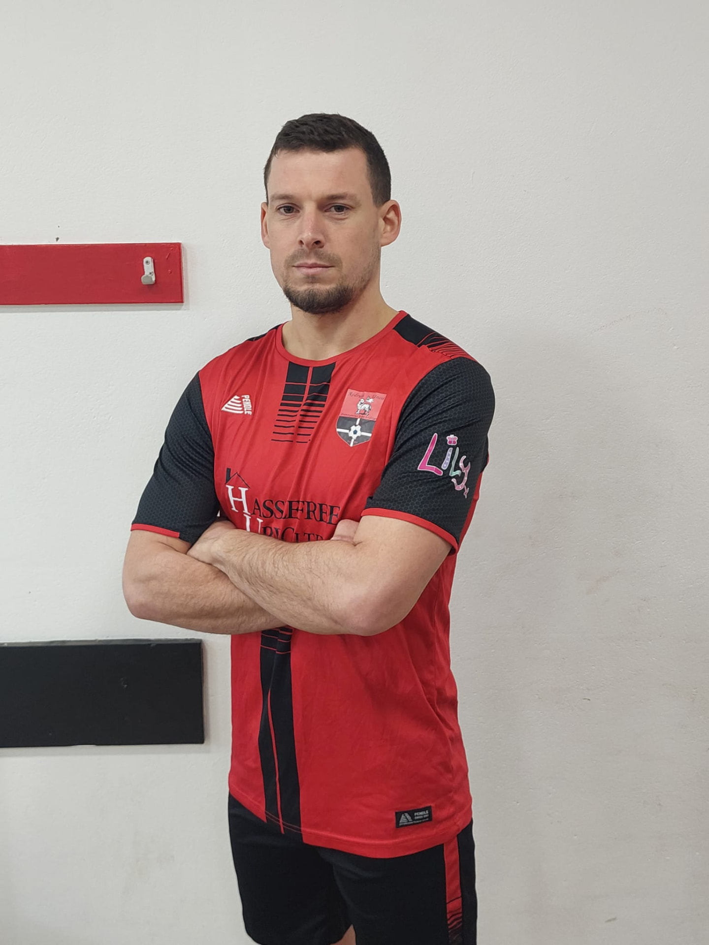 Dan Horler, Director of Football, in Redruth United's red and black kit
